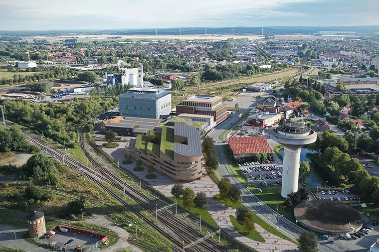 Bildmontage &ouml;ver Kristianstads kommuns f&ouml;rslag f&ouml;r h&ouml;gskolans placering p&aring; Lokstallstomten. Illustration: Arkitekterna Krook & Tj&auml;der Uulas