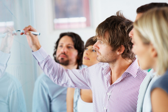 people using a whiteboard